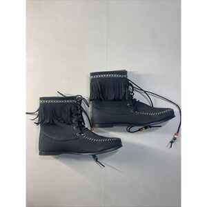 a pair of black suede fringe ankle boots